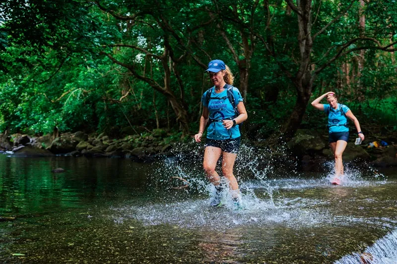 female-adventure-team-trail-running-through-tropical-forest-in-mauritius-during-the-femina-adventure-women-s-raid..webp