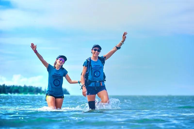 group-of-women-laughing-and-supporting-each-other-during-femina-adventure-mauritius--showing-sisterhood-and-adventure-travel-spirit..webp