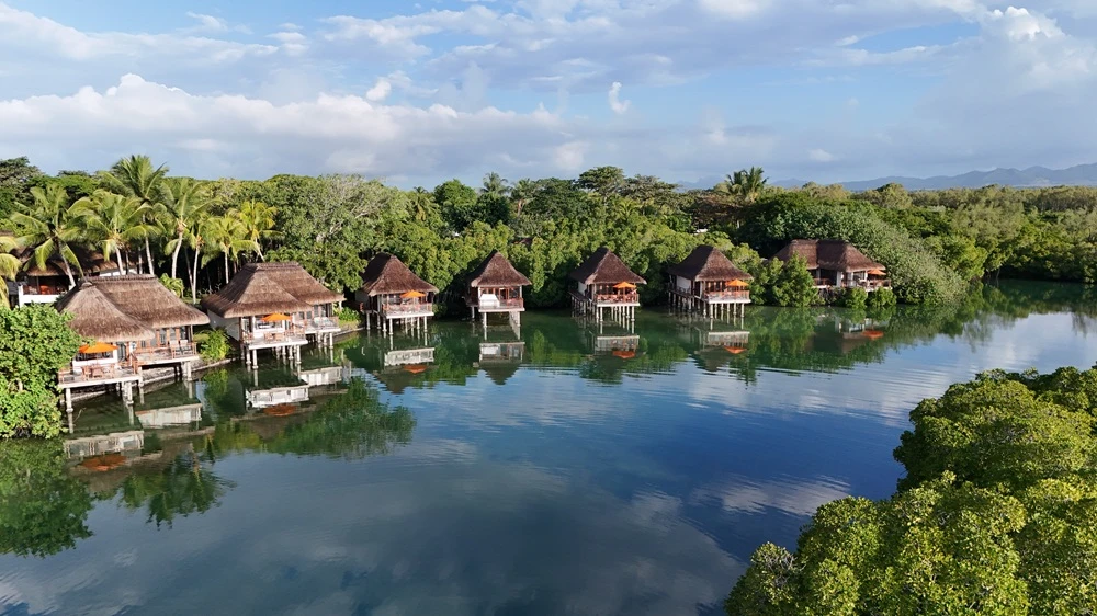 overwater-villa-at-constance-prince-maurice-mauritius--a-romantic-luxury-escape-surrounded-by-calm-lagoon-water-and-tropical-island-scenery..webp