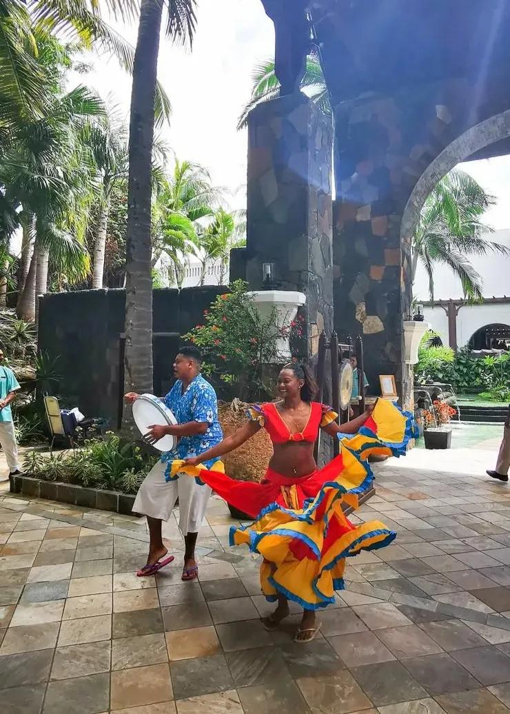 authentic-mauritius-cultural-show-on-the-beach--featuring-sega-dancers--traditional-drums-and-golden-sunset-views-by-the-ocean..webp
