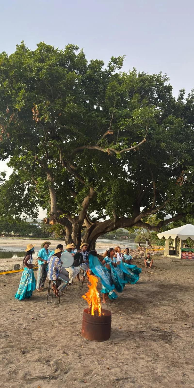 beach-sunset-sega-performance-in-mauritius-with-traditional-dancers--drummers--firelight-and-a-relaxed-tropical-cultural-atmosphere..webp