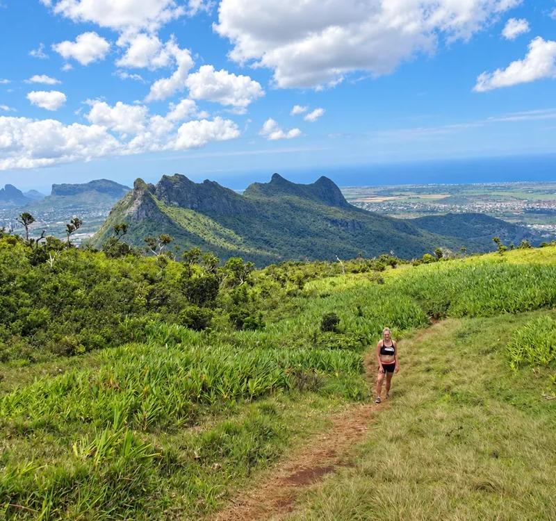 crossing-the-grassy-hillside-at-le-pouce--mauritius..webp