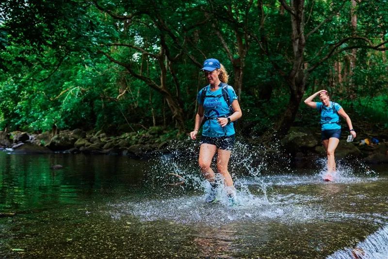 female-adventure-team-trail-running-through-tropical-forest-in-mauritius-during-the-femina-adventure-women-s-raid..webp