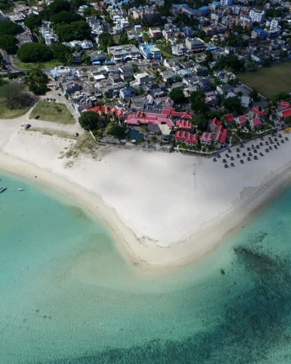 Scenic Flic en Flac Beach in Mauritius, featuring calm lagoon scenery, casuarina trees and one of the island’s most popular coastal destinations.