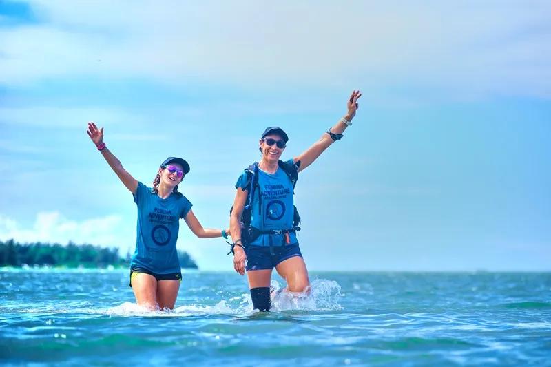 group-of-women-laughing-and-supporting-each-other-during-femina-adventure-mauritius--showing-sisterhood-and-adventure-travel-spirit..webp