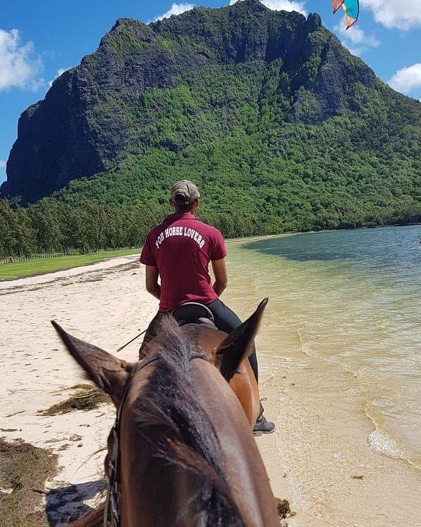 Scenic horseback ride at Le Morne Mauritius, featuring white sand beaches, tropical scenery and breathtaking views of the UNESCO-listed Le Morne Brabant.