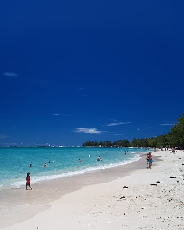 Mont Choisy Beach Mauritius, a long north coast beach known for soft sand, calm lagoon water and family-friendly scenery.