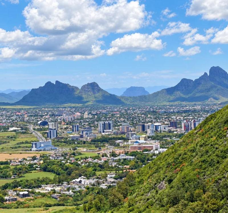 mountain-cityscape-over-a-lush-valley.webp