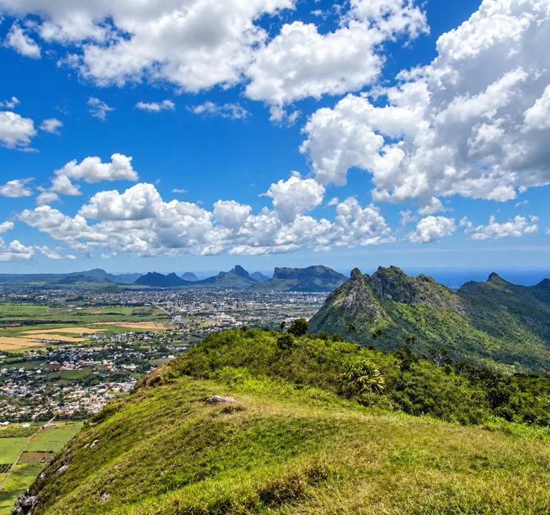 mountaintop-vista-over-valley-and-sea.webp