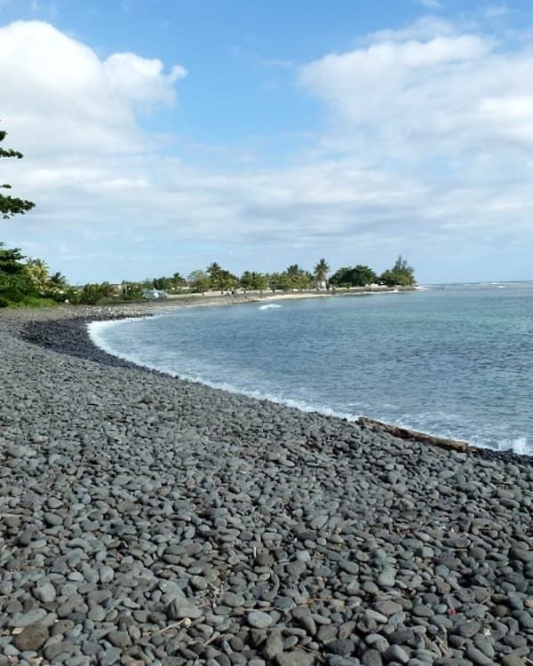 Rivière des Galets Mauritius, a dramatic south coast beach known for black pebbles, powerful waves and wild ocean scenery.