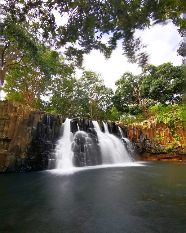 Rochester Falls Mauritius, a beautiful south coast waterfall known for basalt rock formations and tropical greenery.